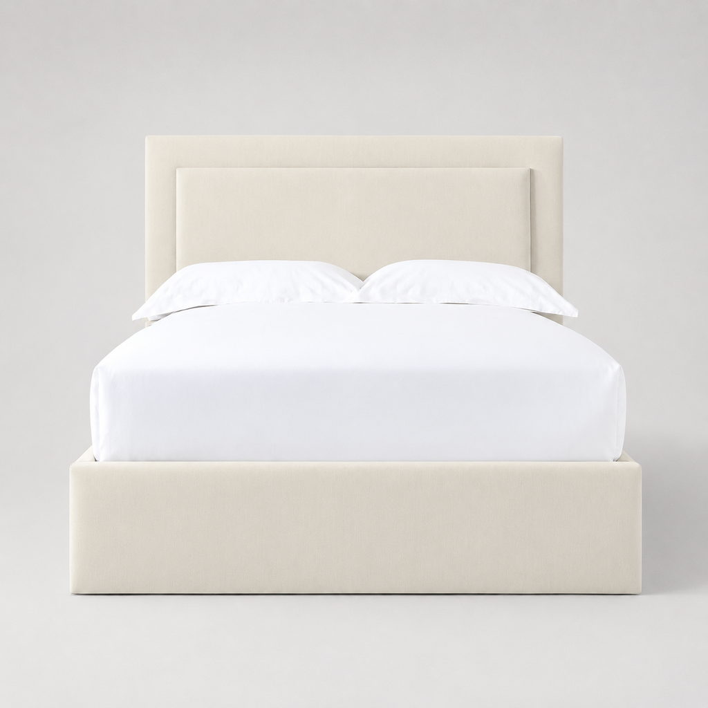 Cream upholstered bed frame with white linens, modern luxury bedroom furniture