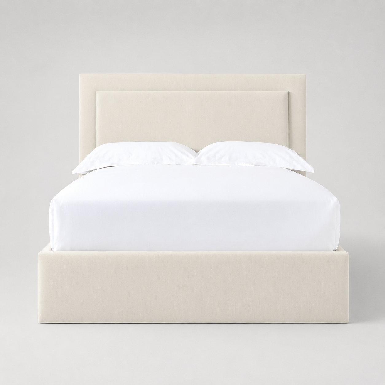 Cream upholstered bed frame with white linens, modern luxury bedroom furniture