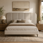 Luxury upholstered bed with tufted headboard in neutral tones, styled with bedding and bedside tables for modern bedroom