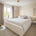 Luxury cream upholstered bed with tufted headboard in modern bedroom, white bedding, gold lighting