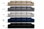 Five modern three-seater sofas in cream, grey, silver, navy blue, and black colors.