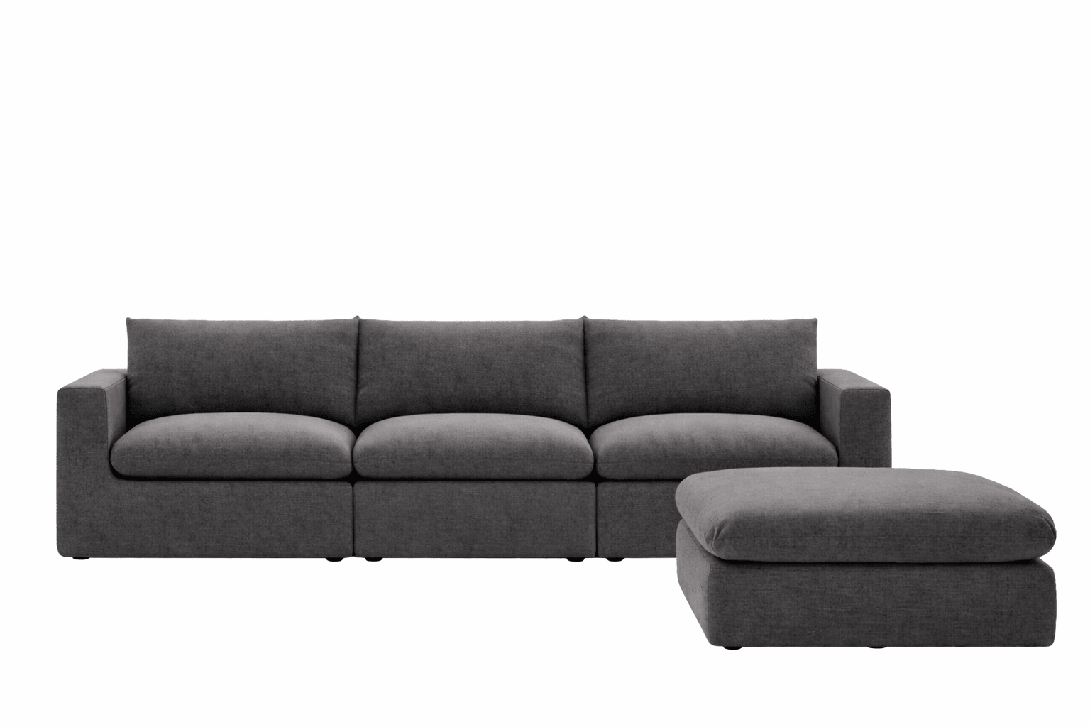 Modern dark grey sectional sofa with wide seat cushions and matching ottoman on white background