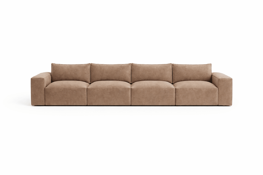 Modern tan four-seater sofa with plush cushions and wide arms on white background