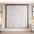 Modern upholstered headboard wall panel in a luxury bedroom with neutral decor