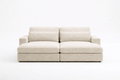 Modern beige fabric sofa with wide cushions and armrests on a white background