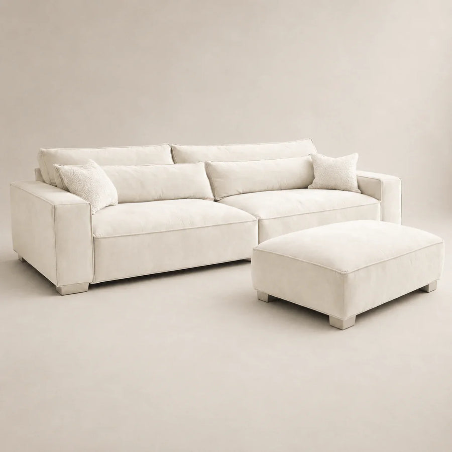 Cream luxury sectional sofa with matching ottoman and decorative pillows, modern living room furniture