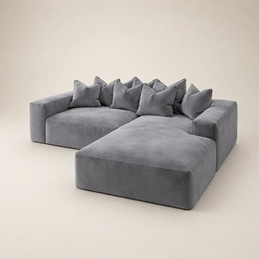 Luxury grey velvet sectional sofa with chaise and plush cushions, modern living room furniture