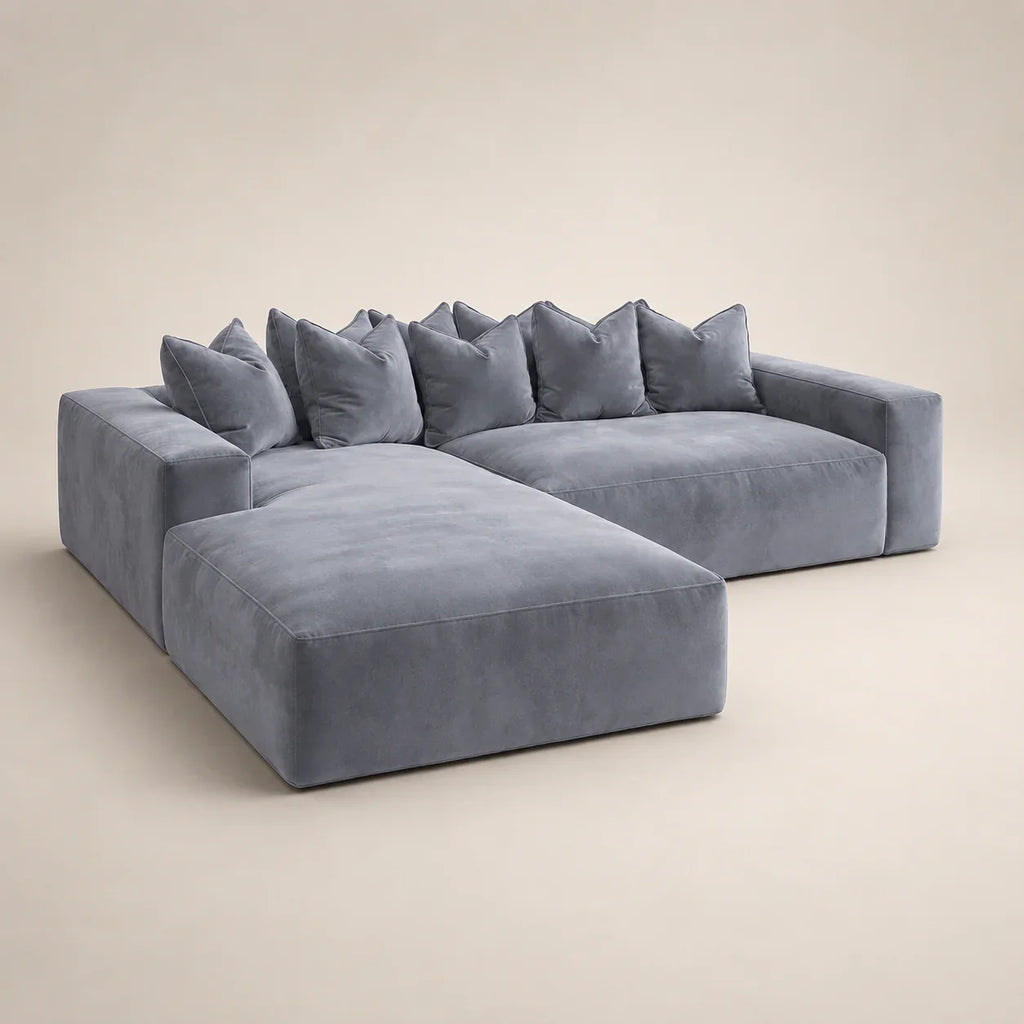 Luxury grey velvet sectional sofa with chaise and plush cushions, modern living room furniture