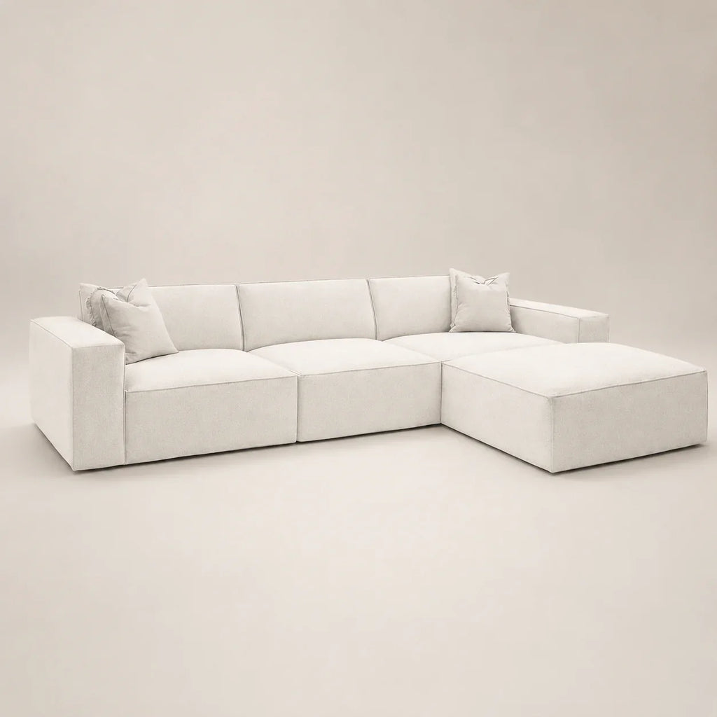Luxury white sectional sofa with chaise and plush cushions, modern minimalist design