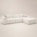 Luxury white sectional sofa with chaise and plush cushions, modern minimalist design