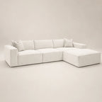 Luxury white sectional sofa with chaise and plush cushions, modern minimalist design