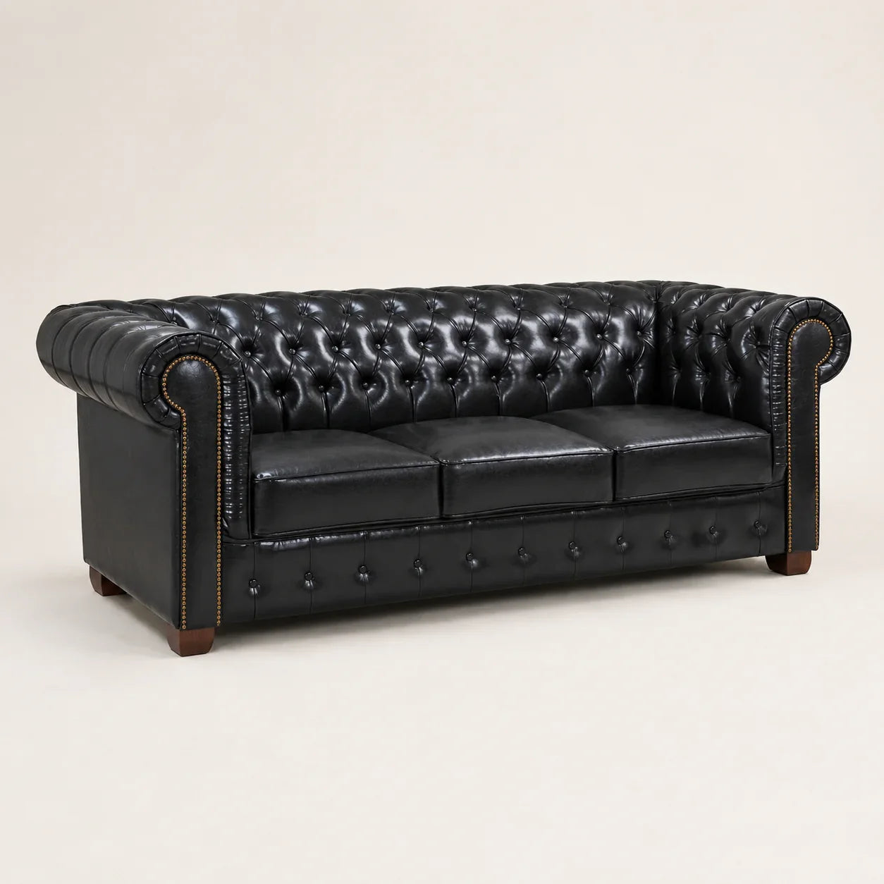 Luxury black leather Chesterfield sofa with tufted back and rolled arms, ideal for elegant living rooms