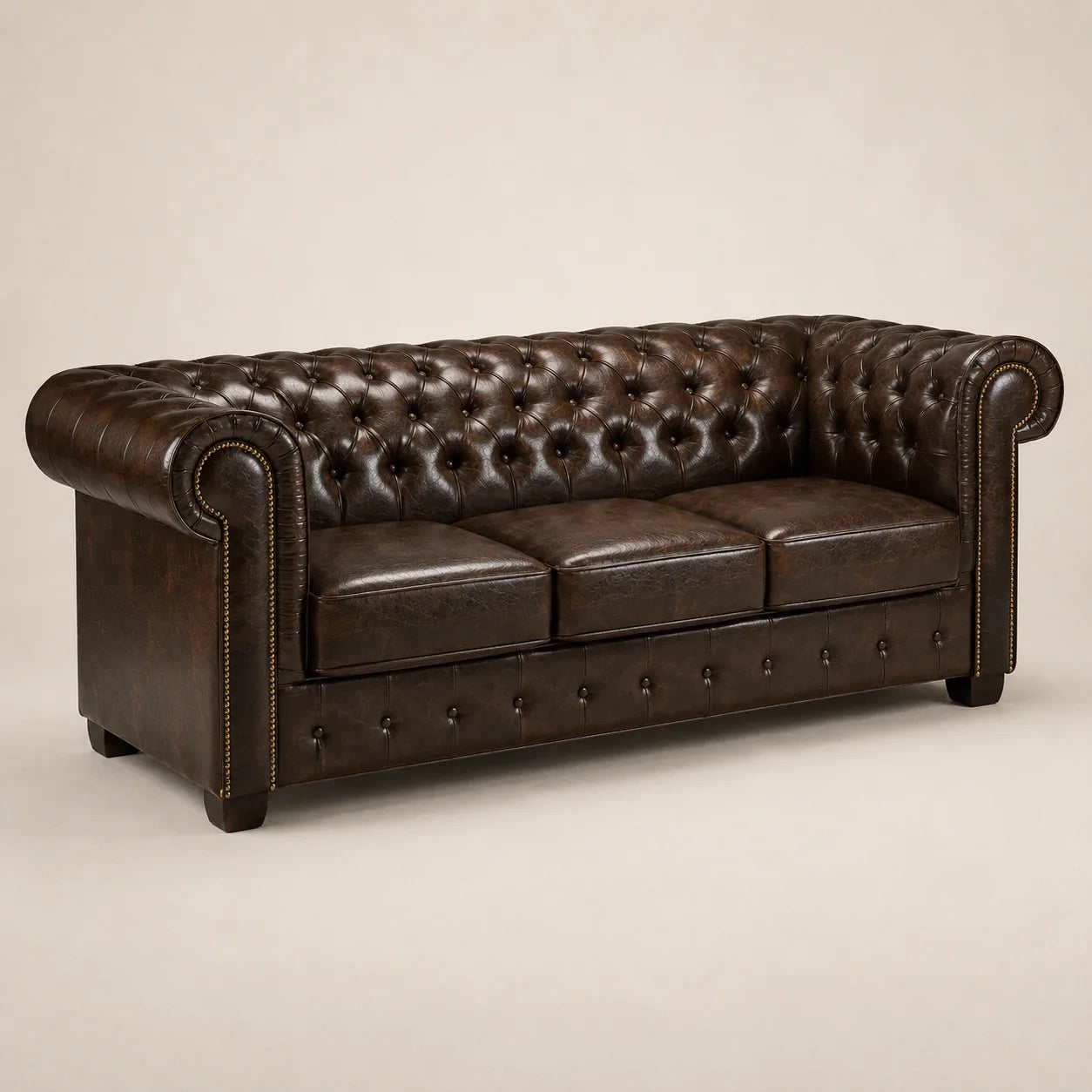 Luxury brown leather Chesterfield sofa with tufted back and rolled arms, perfect for elegant living rooms.