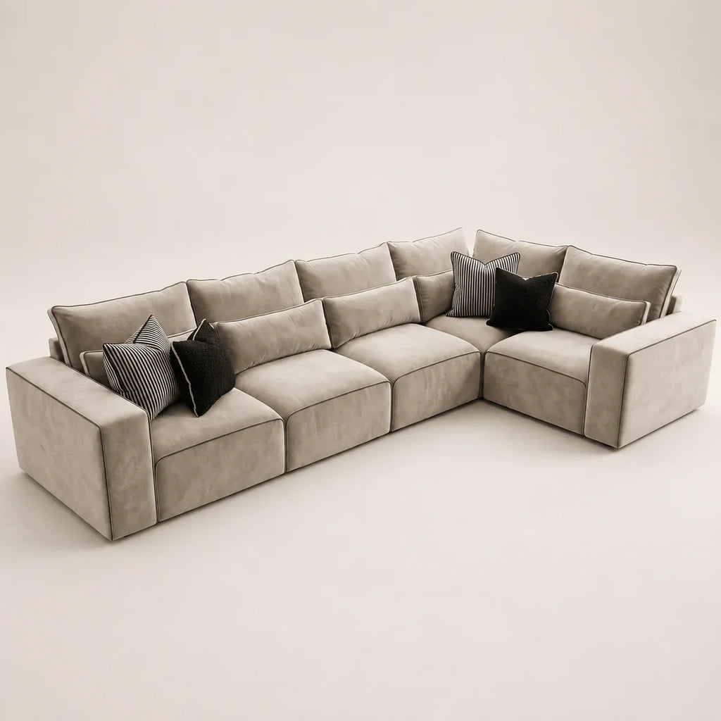 Luxury beige sectional sofa with black and striped throw pillows, modern living room furniture