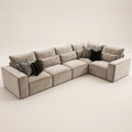 Luxury beige sectional sofa with black and striped throw pillows, modern living room furniture