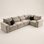 Luxury beige sectional sofa with black and striped throw pillows, modern living room furniture