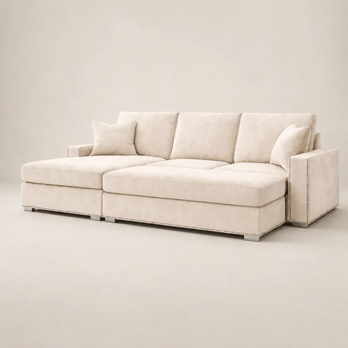 Luxury beige sectional sofa with chaise, nailhead trim, and plush cushions for modern living rooms
