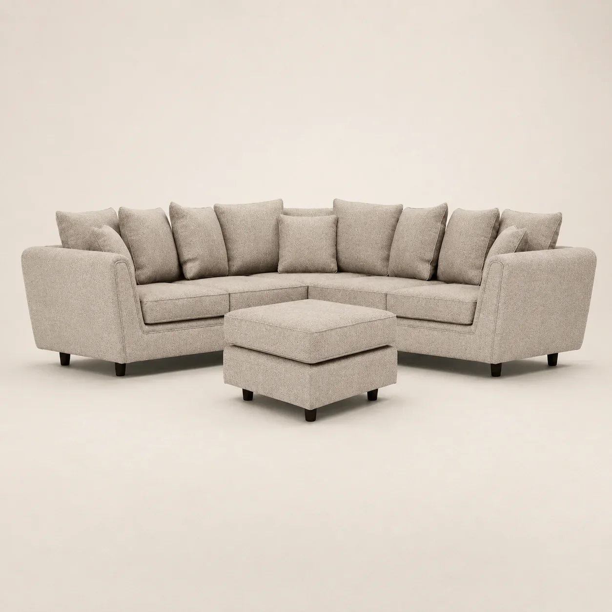 Luxury beige sectional sofa with matching ottoman, ideal for modern living rooms