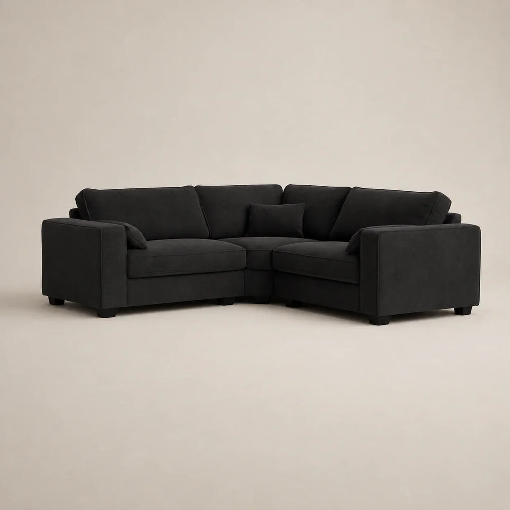 Black fabric corner sofa with plush cushions, ideal for modern living rooms