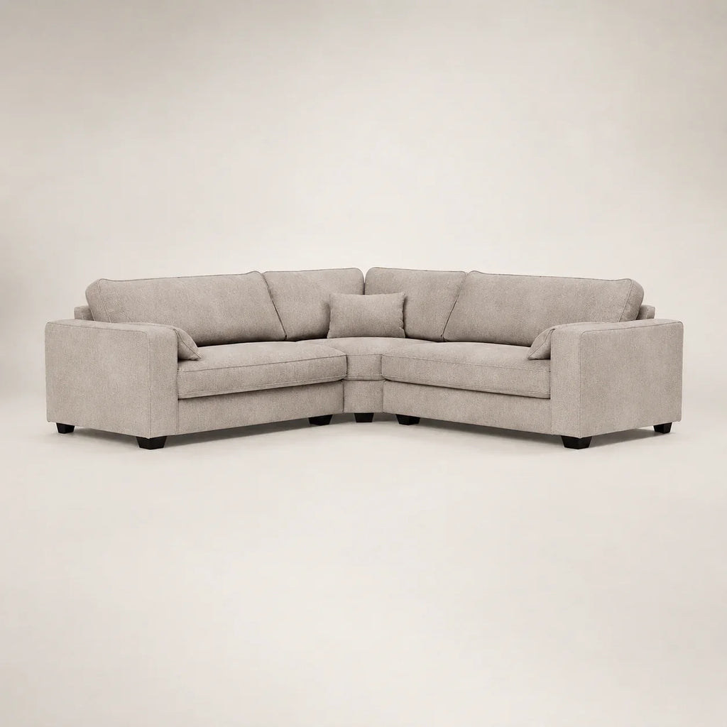 Modern grey L-shaped sectional sofa with plush cushions and dark legs, ideal for luxury living rooms