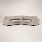 Modern grey L-shaped sectional sofa with plush cushions and dark legs, ideal for luxury living rooms