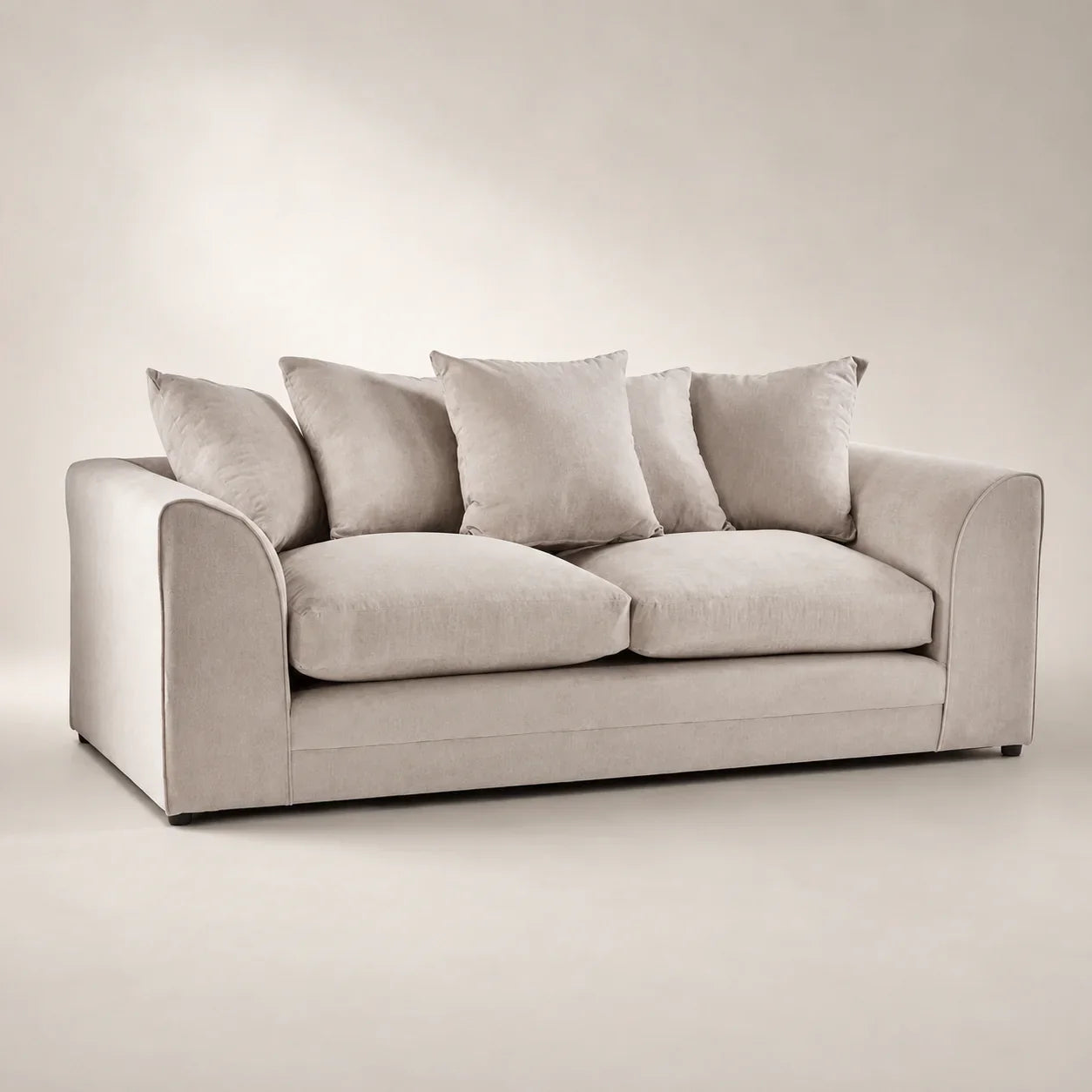 Luxury beige velvet sofa with plush cushions, ideal for modern living rooms