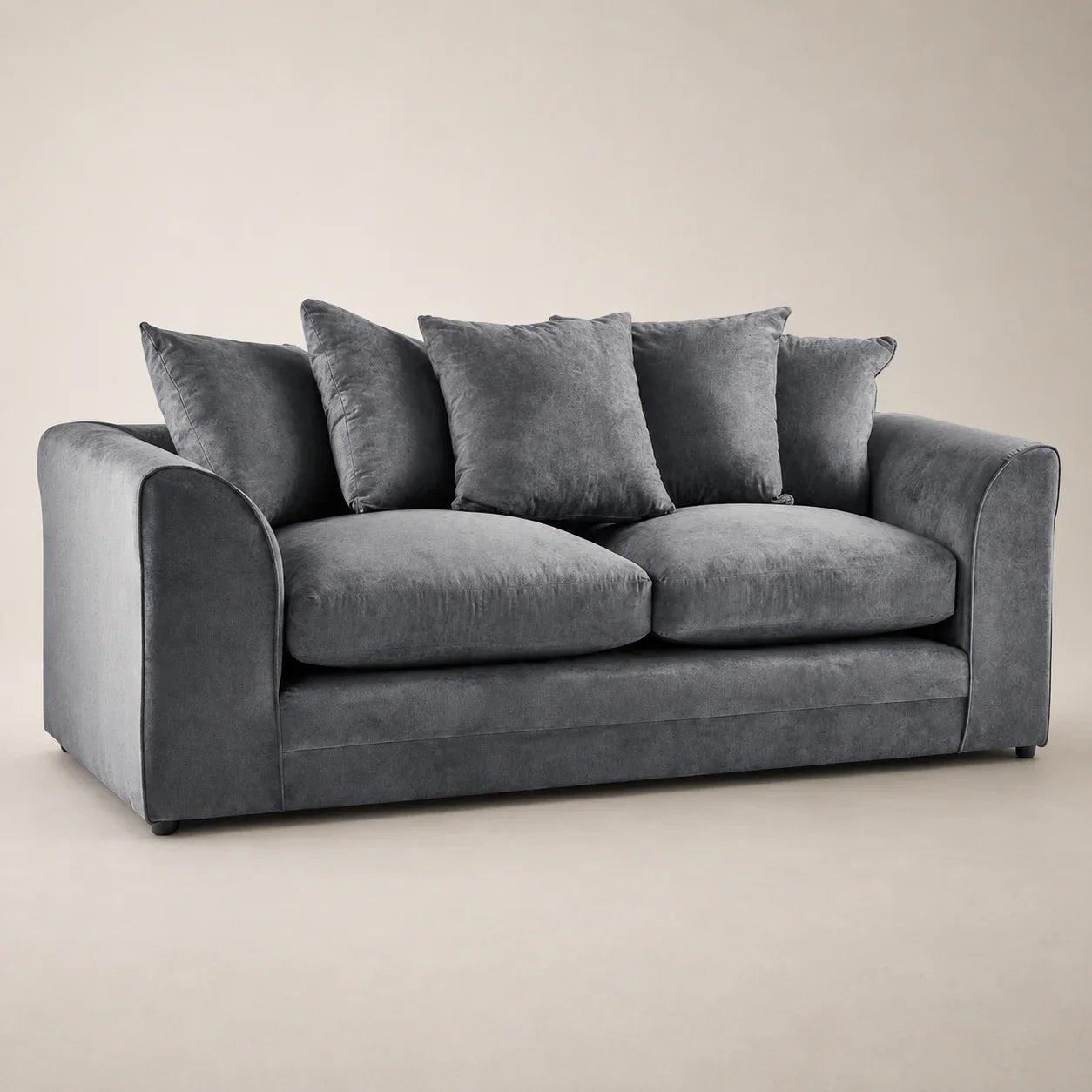 Luxury grey velvet sofa with plush cushions, ideal for modern living rooms