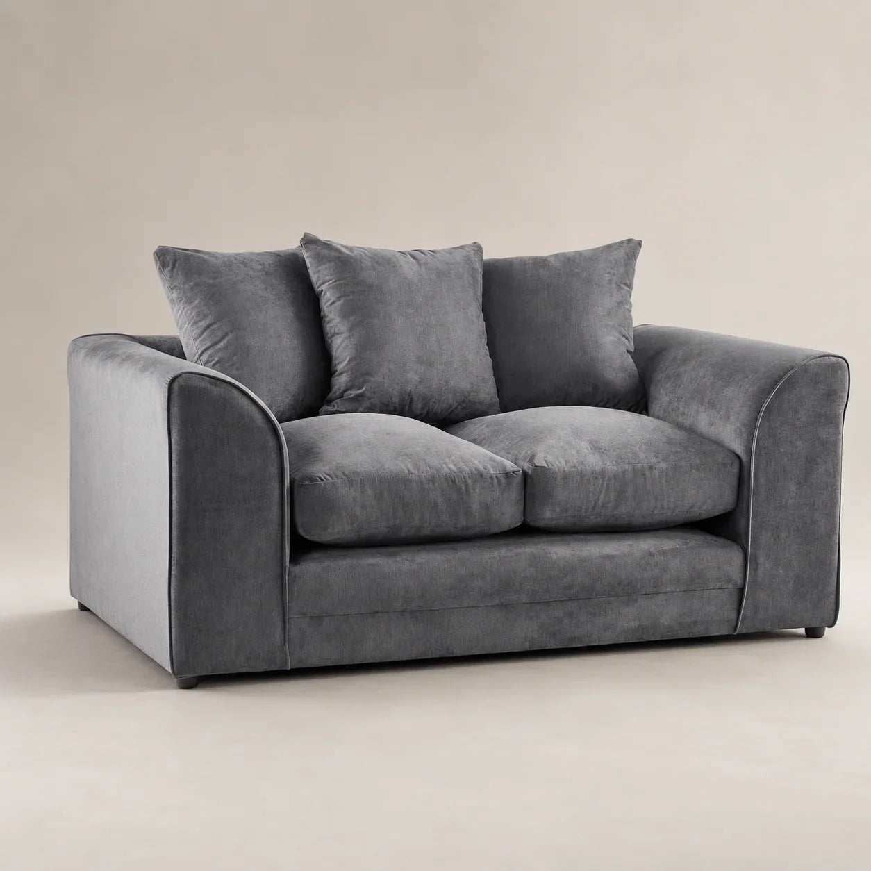 Grey velvet two-seater sofa with plush cushions, luxury living room furniture
