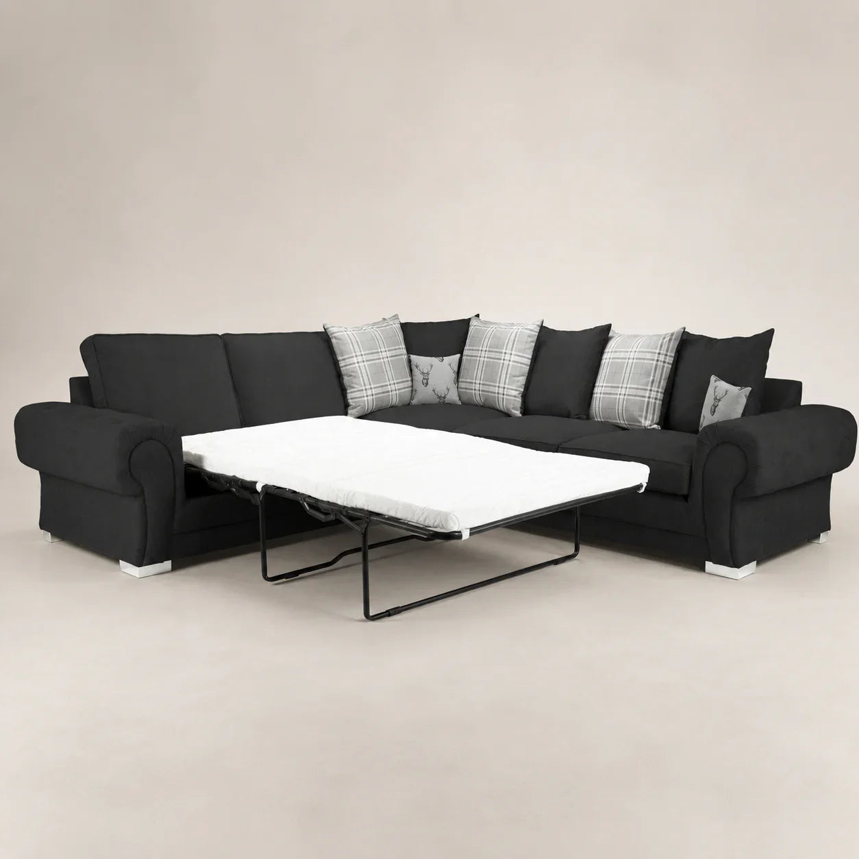 Black sectional sofa with pull-out bed and plaid pillows, luxury living room furniture