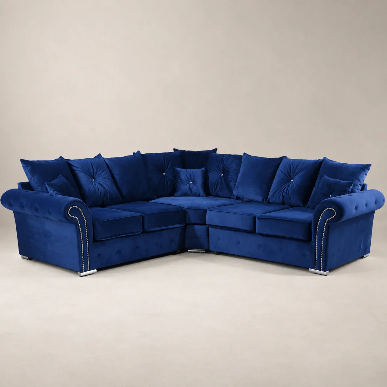 Luxury navy blue velvet sectional sofa with tufted cushions and nailhead trim, perfect for modern living rooms