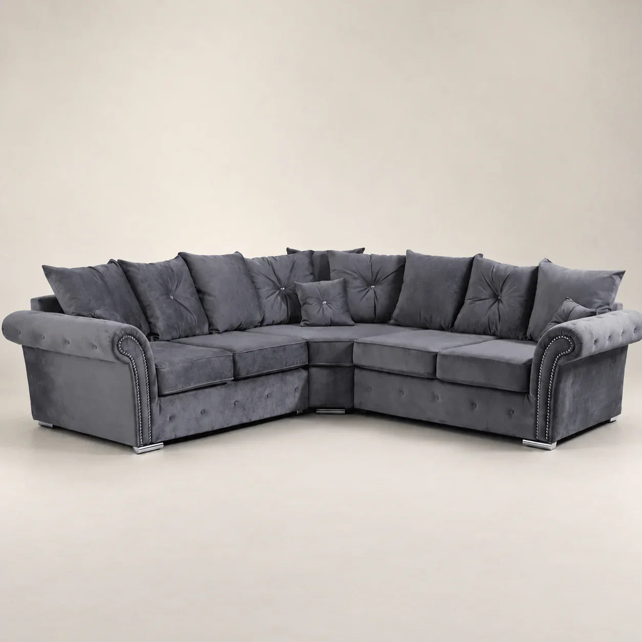 Luxury grey velvet corner sofa with tufted cushions and chrome legs, ideal for modern living rooms