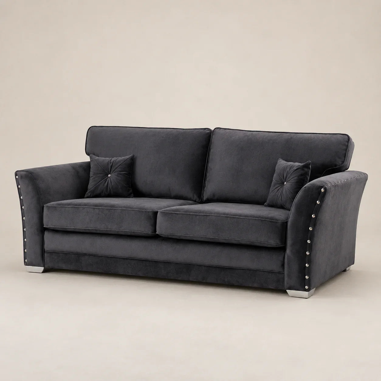 Luxury dark grey velvet sofa with studded arms and matching cushions, ideal for modern living rooms.