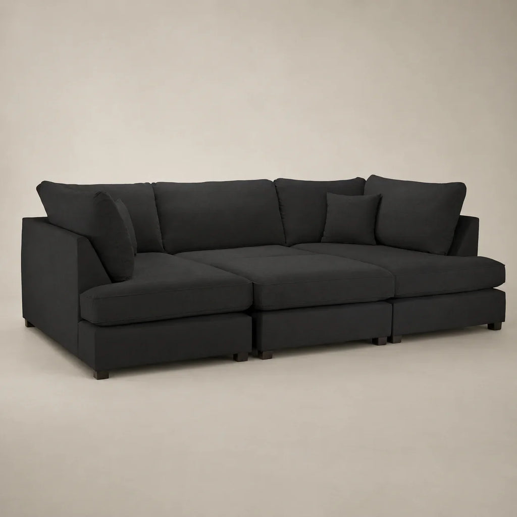 Black modular sectional sofa with chaise and plush cushions for modern living room