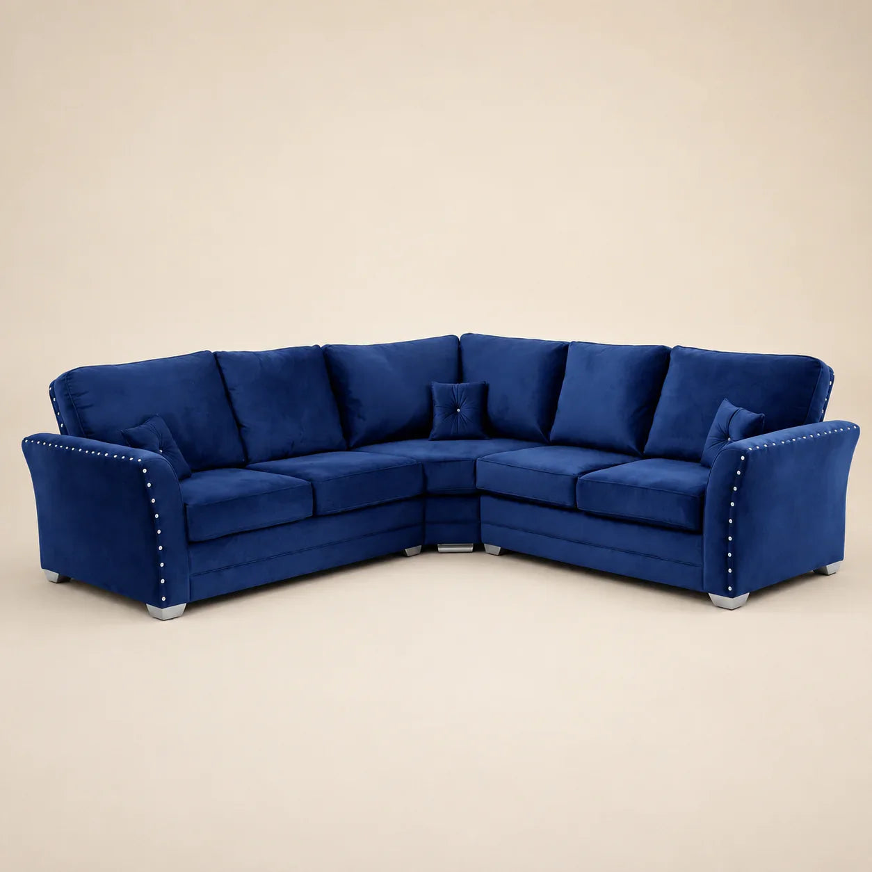 Luxury navy blue velvet corner sofa with studded arms and matching cushions, ideal for modern living rooms.