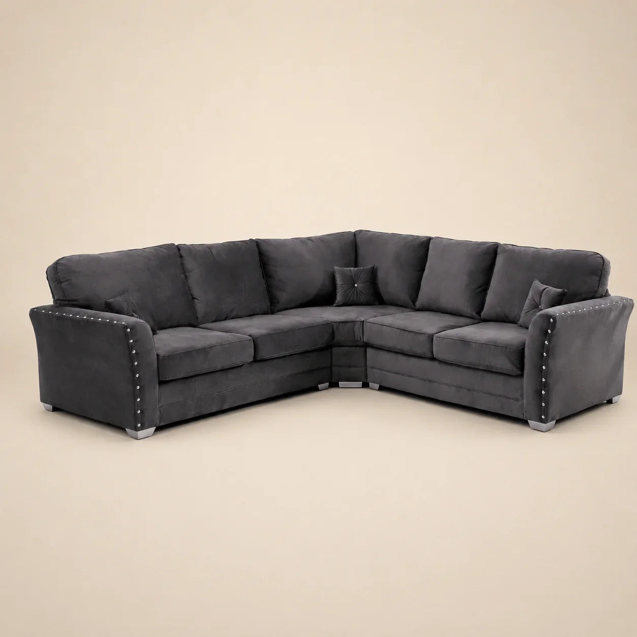 Luxury dark grey corner sofa with studded arms and plush cushions, ideal for modern living rooms.