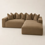 Luxury beige sectional sofa with plush cushions and chaise lounge, modern living room furniture