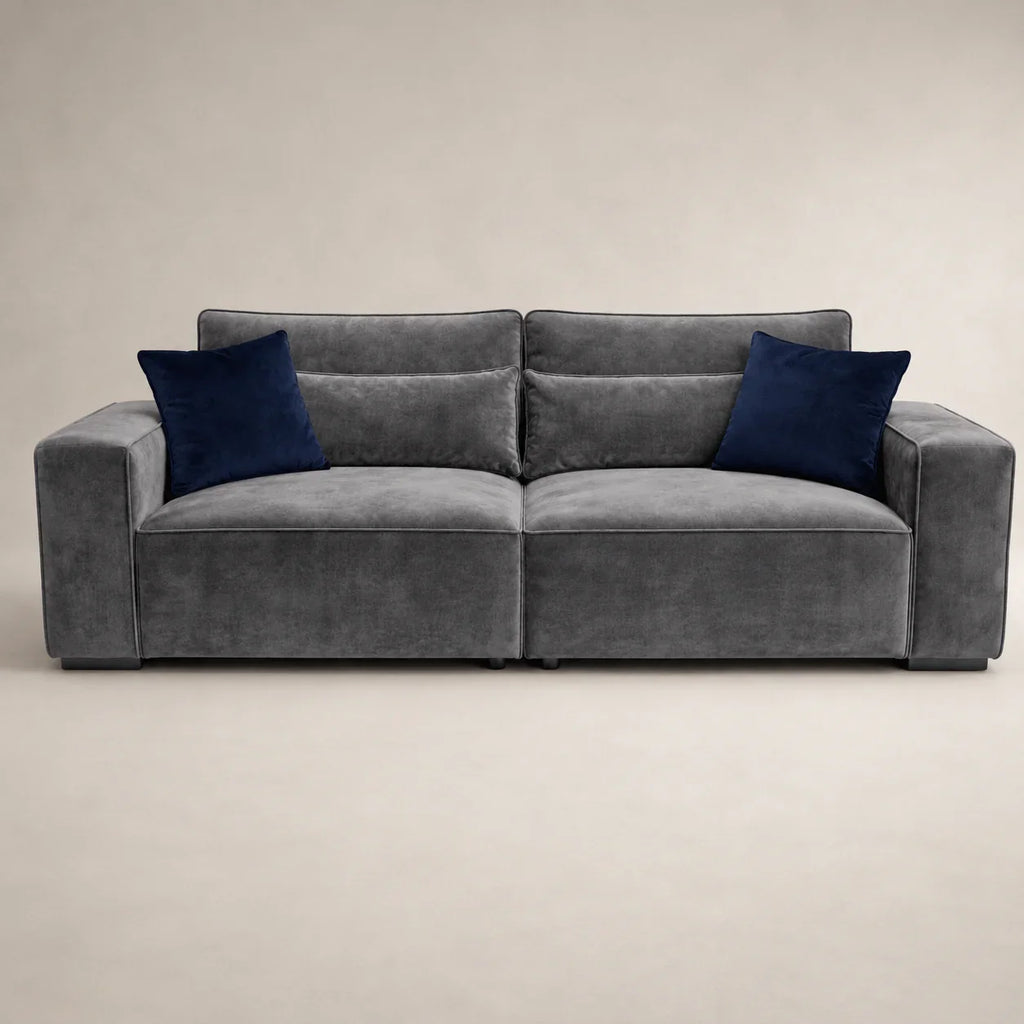 Gray velvet sofa with navy blue cushions, modern luxury living room furniture