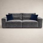 Gray velvet sofa with navy blue cushions, modern luxury living room furniture