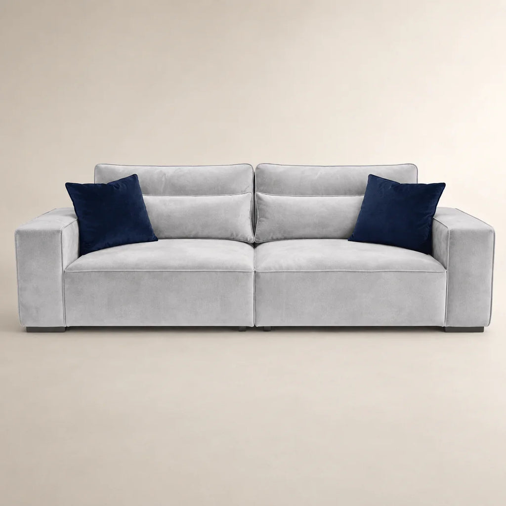 Luxury gray velvet sofa with navy blue cushions, modern design for living room comfort