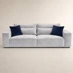 Luxury gray velvet sofa with navy blue cushions, modern design for living room comfort