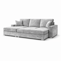 Modern grey velvet sectional sofa with chaise, plush cushions, and nailhead trim on white background