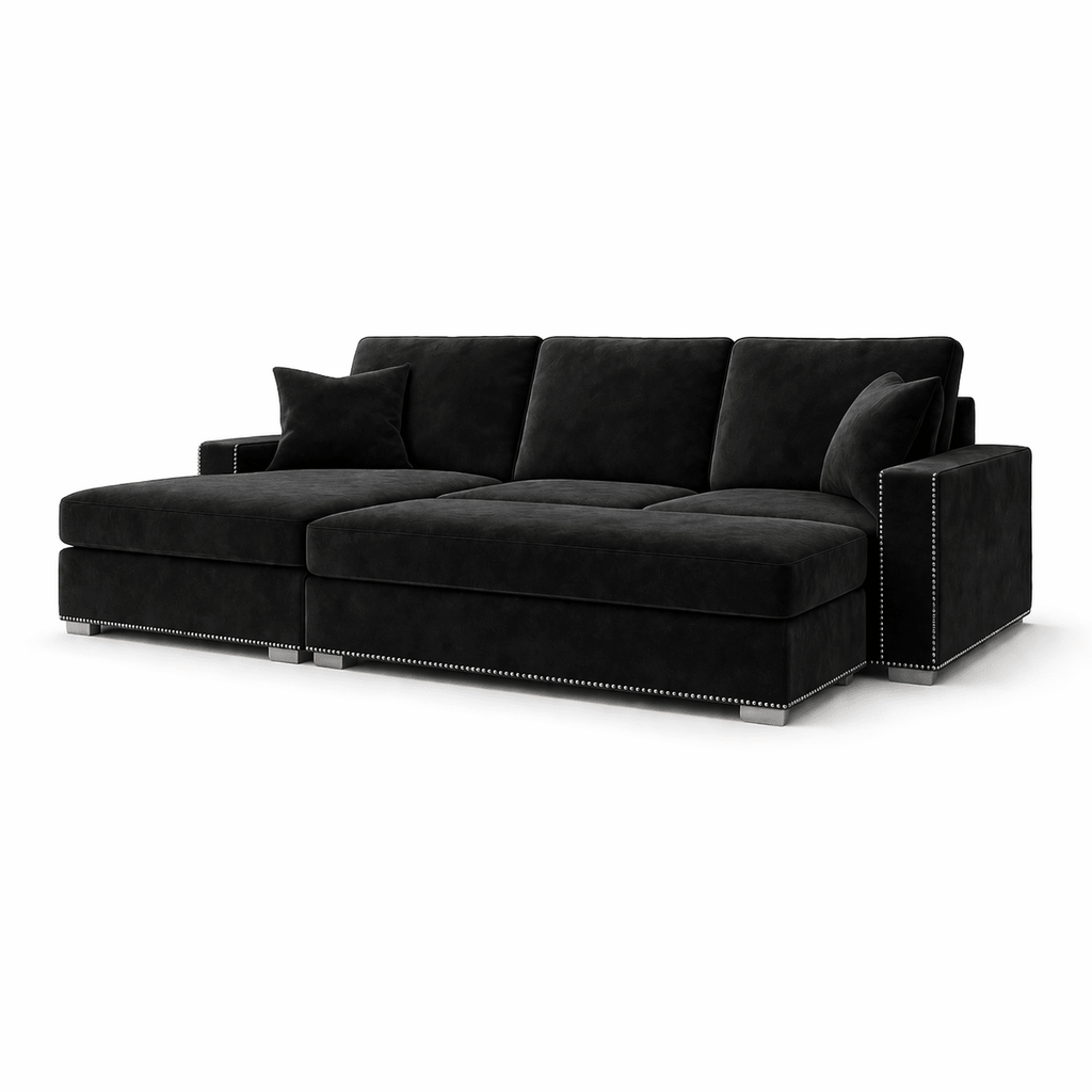 Modern black velvet sectional sofa with metal stud trim and plush cushions