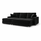 Modern black velvet sectional sofa with metal stud trim and plush cushions