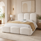 Luxury upholstered bed with tufted headboard and footboard in neutral bedroom setting