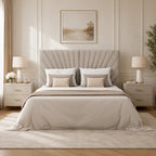 Luxury upholstered bed with tufted headboard, neutral bedding, and matching nightstands in a modern bedroom