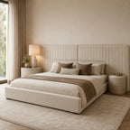Luxury beige upholstered bed with tufted headboard, neutral bedding, and matching nightstands in modern bedroom