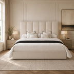 Luxury upholstered bed with tufted headboard, white bedding, and black trim in modern bedroom