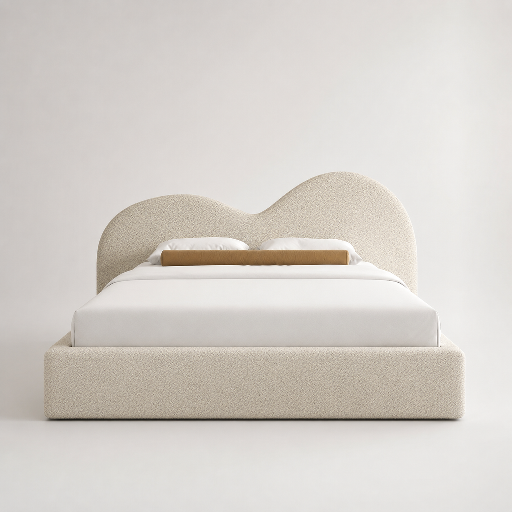 Luxury upholstered bed with curved headboard, white bedding, and beige textured fabric