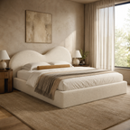 Luxury upholstered bed with curved headboard in neutral bedroom, perfect for modern interiors
