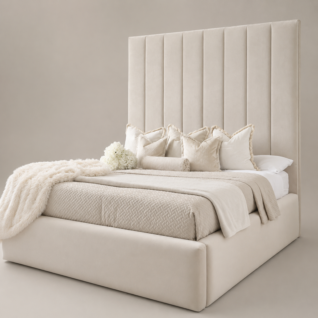 Luxury beige upholstered bed with tall tufted headboard, plush pillows, and cozy throws for modern bedroom decor